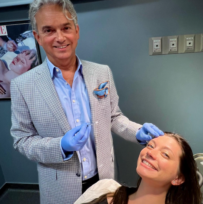 Dr. Henry Garazo with a patient before her injectable treatment