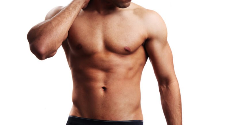 Isolated image of a fit, shirtless man against a white background
