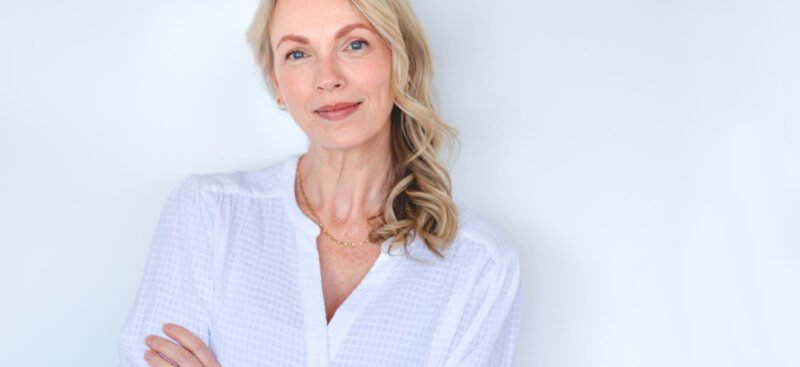 Beautiful senior woman smiling with raised brows