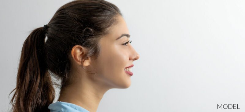 Smiling young teen with hair pulled back