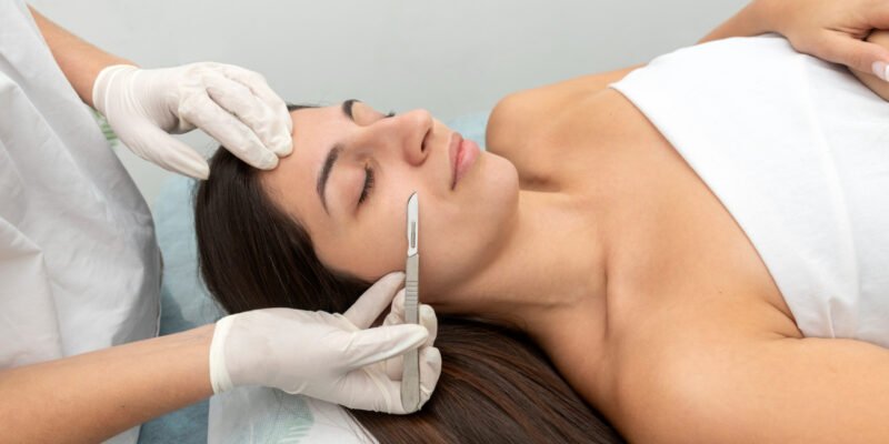 Young woman getting a dermaplaning treatment at a medical spa